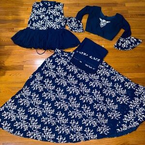 Traditional Indian choli that is a rich blue with 4 pieces.